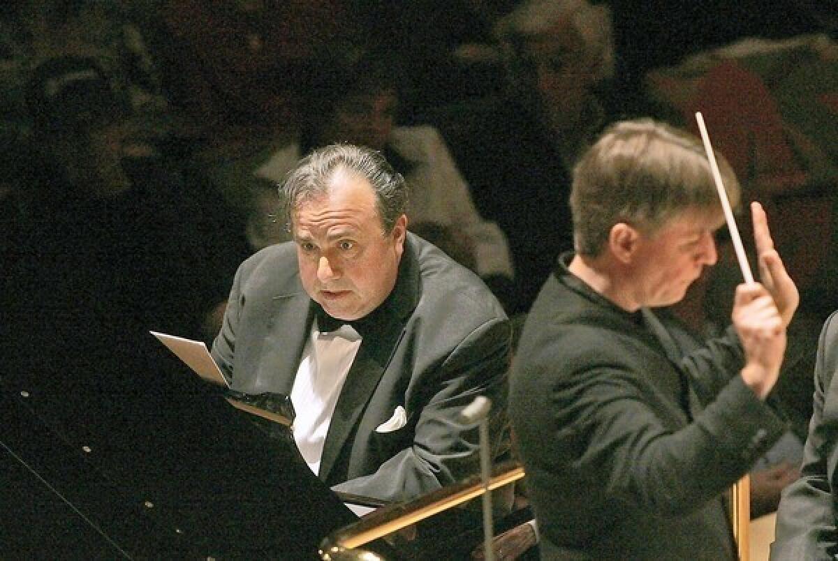 Yefim Bronfman plays piano as Esa-Pekka Salonen conducts the L.A. Philharmonic as they perform Piano Concerto by Salonen at the Walt Disney Concert Hall on May 29, 2008.