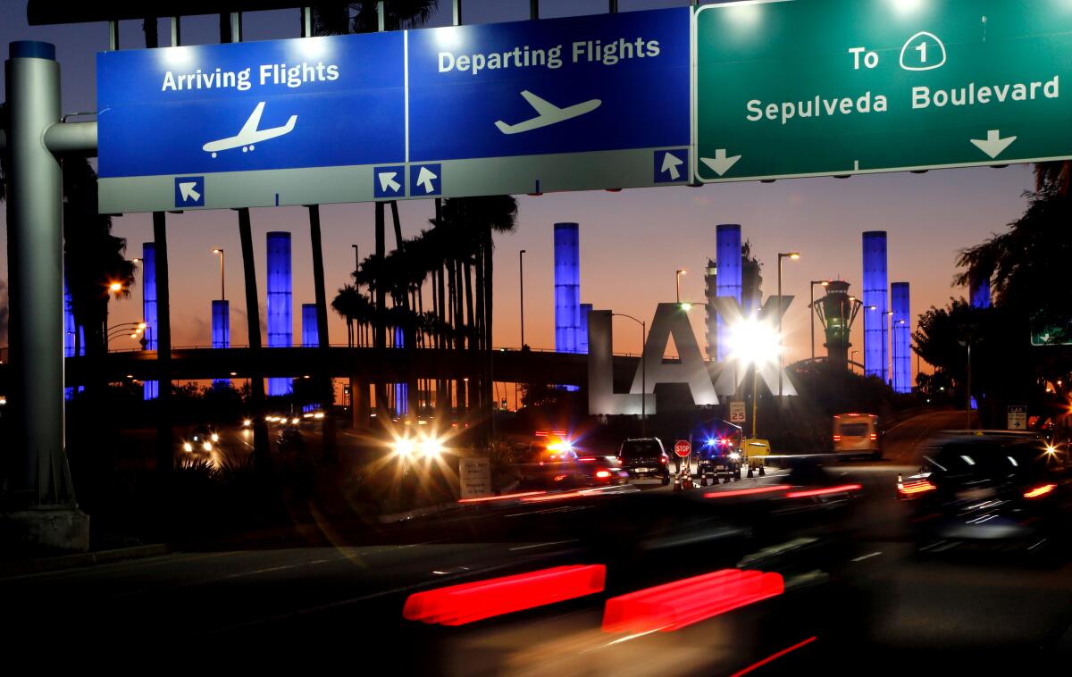 A 2013 file photo of the lighted pylons at Los Angeles International Airport.