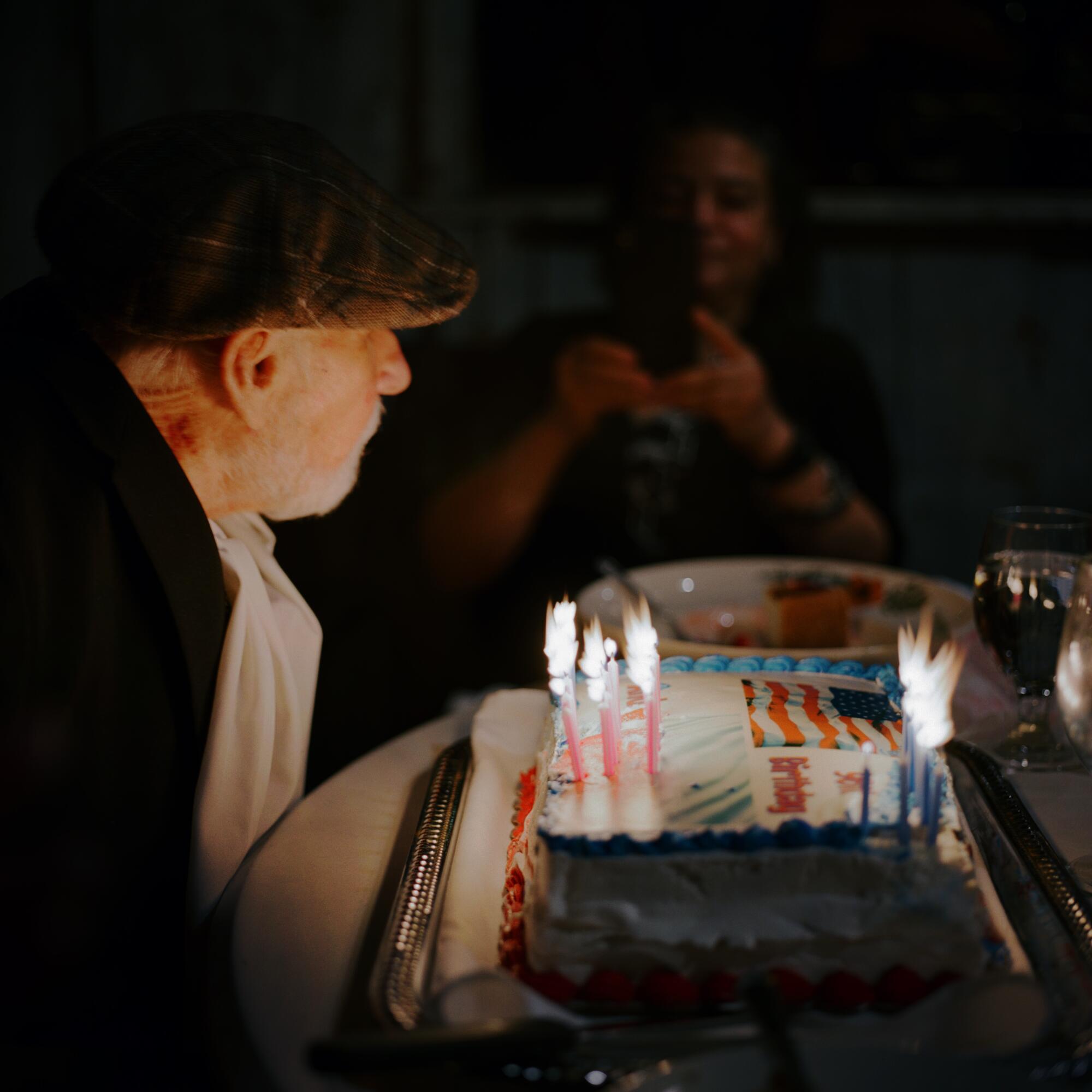 Andrew listens to his family and friends sing happy birthday at a restaurant for his 96th birthday on Oct. 10.