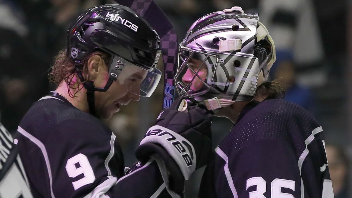 Kings goaltender Jack Campbell, right, celebrates with center Adrian Kempe after they defeated the New York Rangers on Sunday.