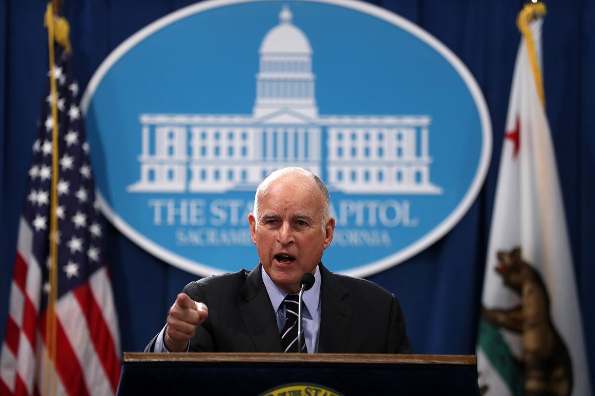 California Gov. Jerry Brown speaks to reporters at the Capitol on Thursday.