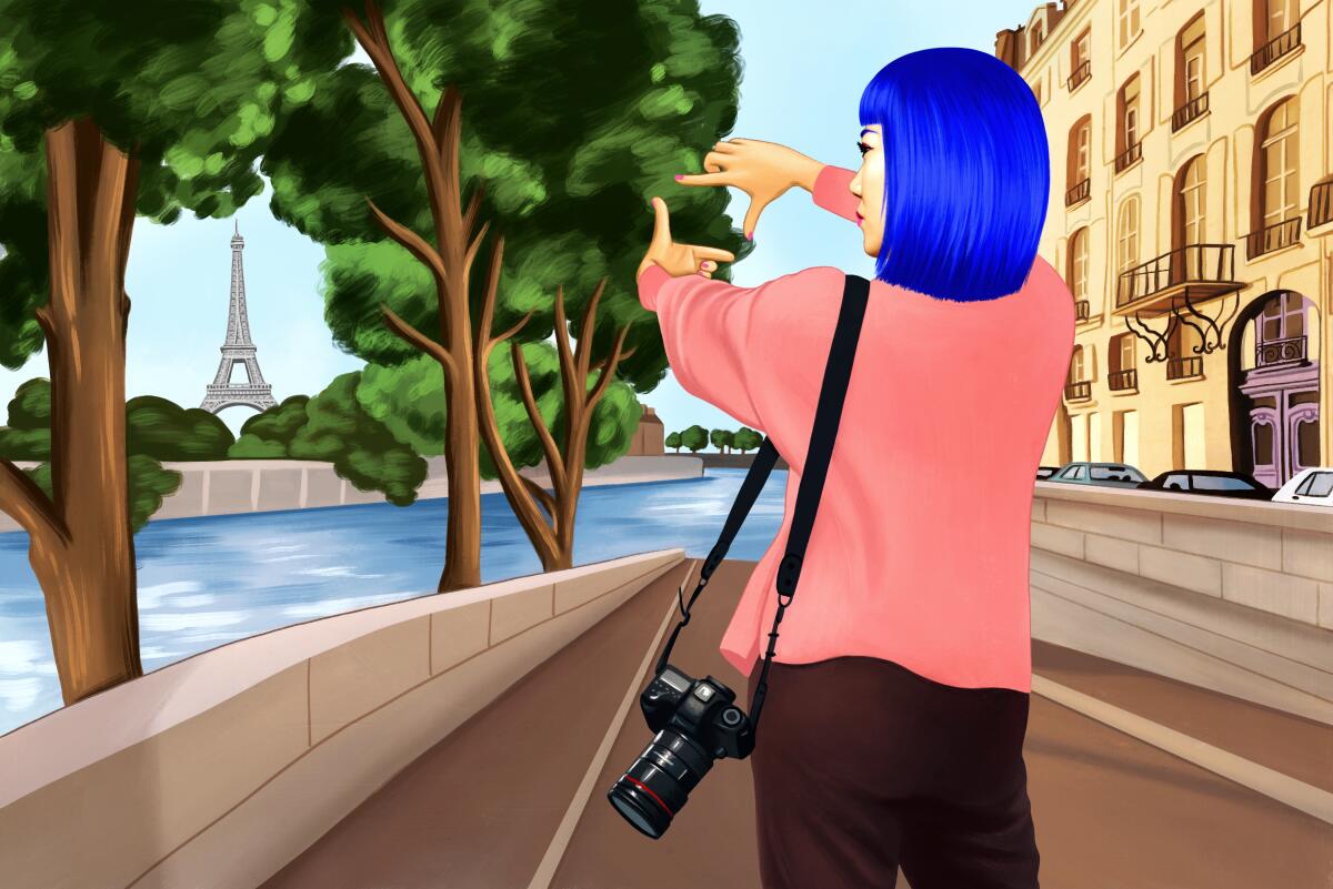 Illustration of a location scout, framing the Eiffel Tower using her fingers. She wears a pink sweater and blue hair.