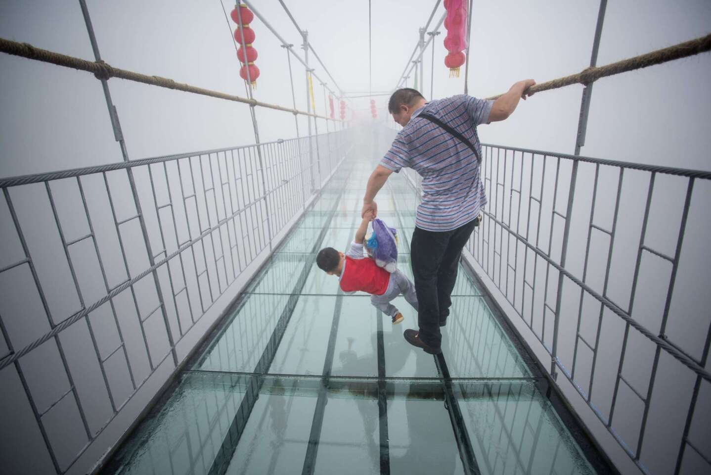 Glass walkway over canyon in China