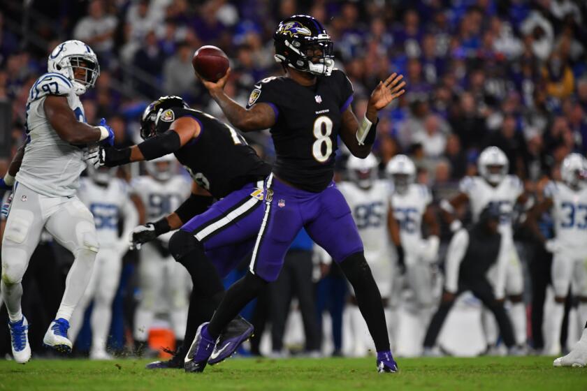 Baltimore Ravens quarterback Lamar Jackson (8) looks to pass during an NFL football game between the Baltimore Ravens and the Indianapolis Colts on Monday, Oct. 11, 2021, in Baltimore. (AP Photo/Larry French)