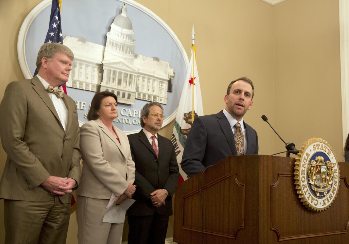 Assemblyman Marc Levine (D-San Rafael), right, discusses the bill that he, Assemblyman Mark Stone (D-Scotts Valley), left, and Assembly Speaker Toni Atkins (D-San Diego) coauthored to require lobbyists to report their interactions with members of the California Coastal Commission.