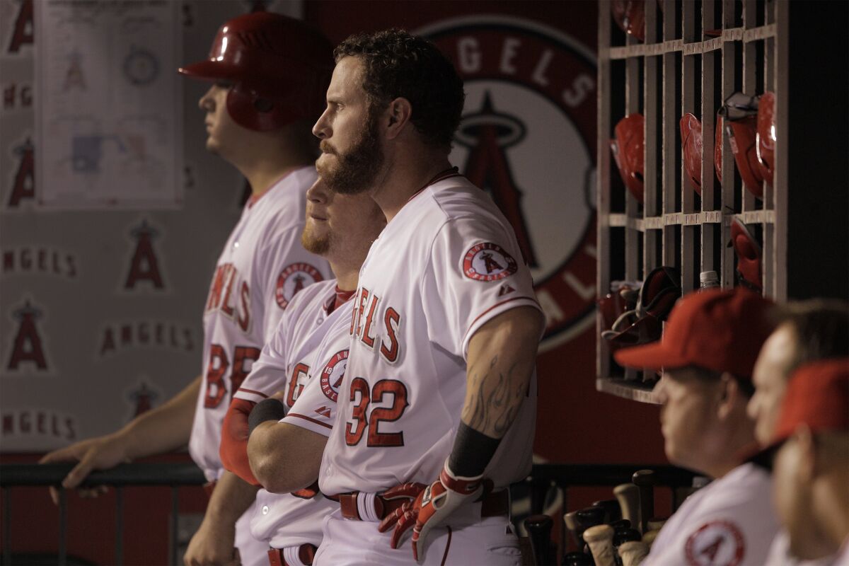 Angels left fielder Josh Hamilton (32) watches from the dugout during a game against the Seattle Mariners on Sept. 16.
