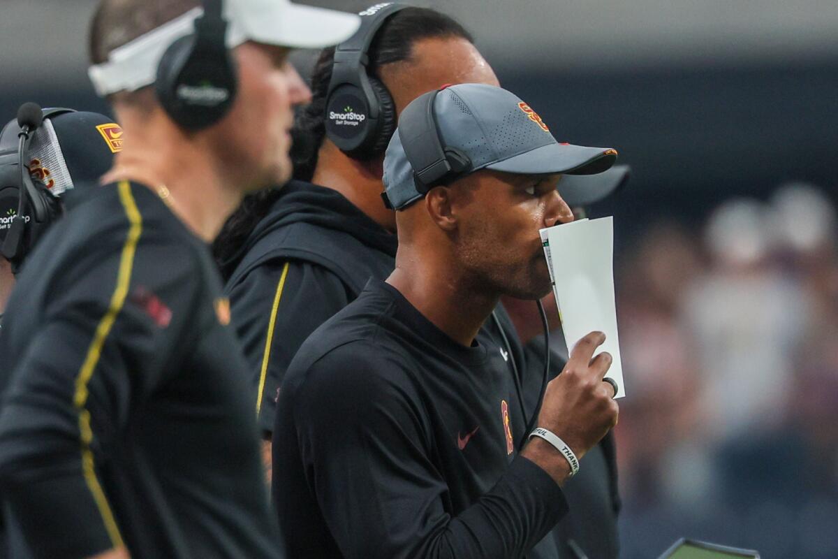 USC defensive coordinator D'Anton Lynn calls a play 