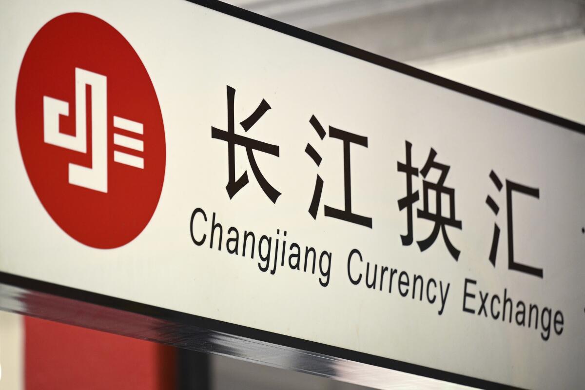 A sign for a Changjiang Currency Exchange business