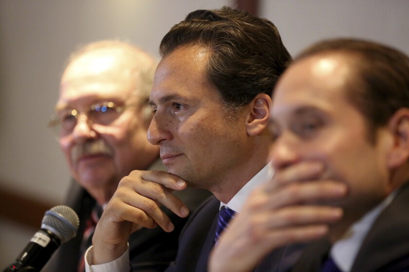 Flanked by his lawyers, Emilio Lozoya, former head of Mexico's state-owned oil company Pemex