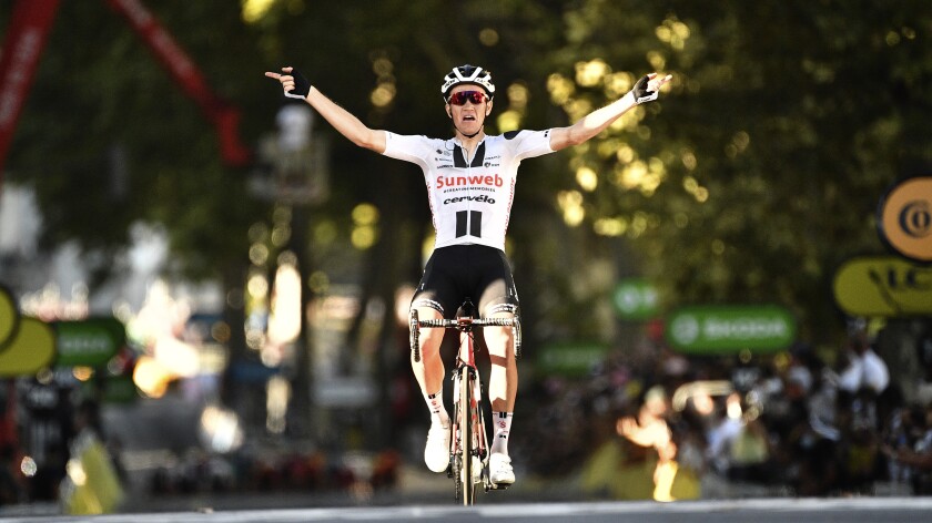 Soren Kragh Andersen crosses the finish line to win the 14th stage of the Tour de France on Saturday.