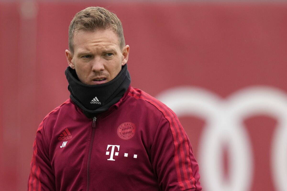 FILE - FC Bayern Munich's head coach Julian Nagelsmann arrives for a training session in Munich, Germany, Oct. 19, 2021. Bayern Munich coach Julian Nagelsmann will return to the bench against Benfica in the Champions League on Tuesday Nov. 2, 2021, after missing four games with the coronavirus. (AP Photo/Matthias Schrader, File)