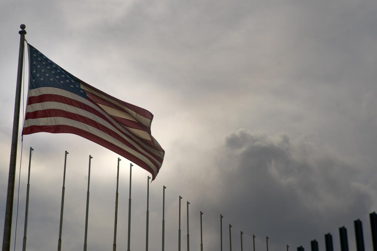 FILE - U.S. flag flies at the U.S. embassy in Havana, Cuba, March 18, 2019 days after the U.S. State Department announced it was eliminating a five-year tourist visa for Cubans. Cuban authorities confirmed on April 19, 2022 that migration talks with the U.S. will take place, the first in four years since the hardening of relations between both countries and amid an increase in arrivals of Cuban citizens to the southern border of the U.S. (AP Photo/Ramon Espinosa, File)