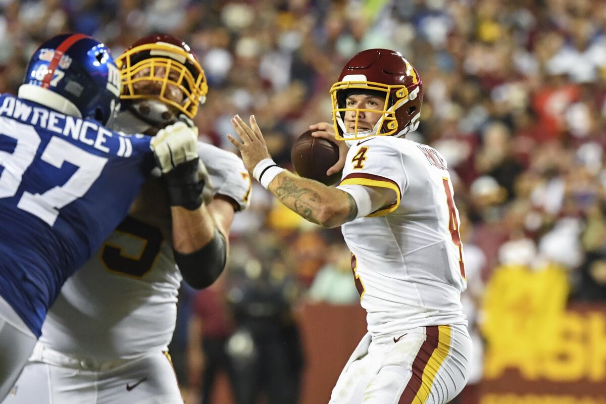Washington quarterback Taylor Heinicke looks to pass against the New York Giants.