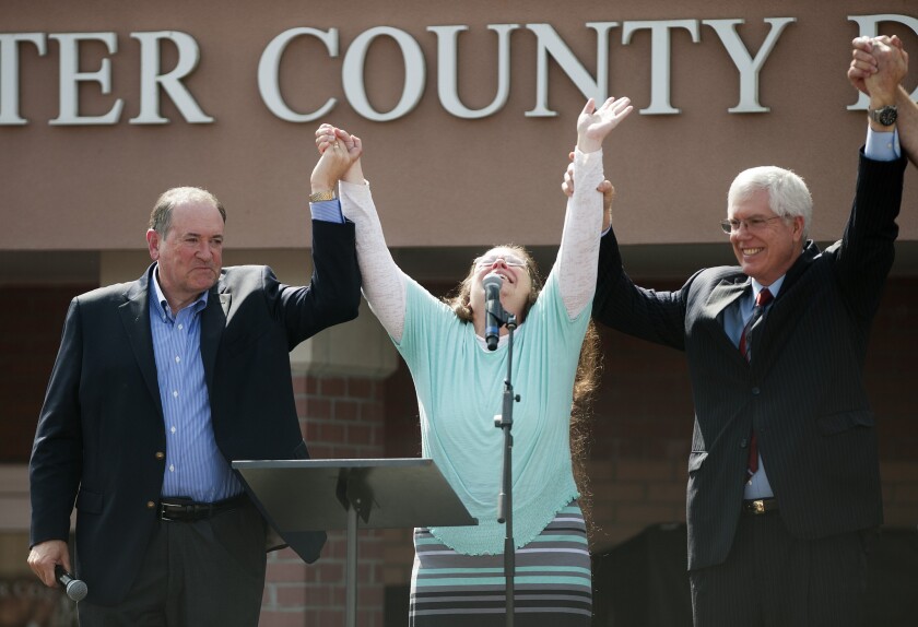 Rowan County Clerk of Courts Kim Davis is flanked her attorney Mat Staver, right, and Republican presidential candidate Mike Huckabee in front of the Carter County Detention Center on Sept. 8 in Grayson, Ky.