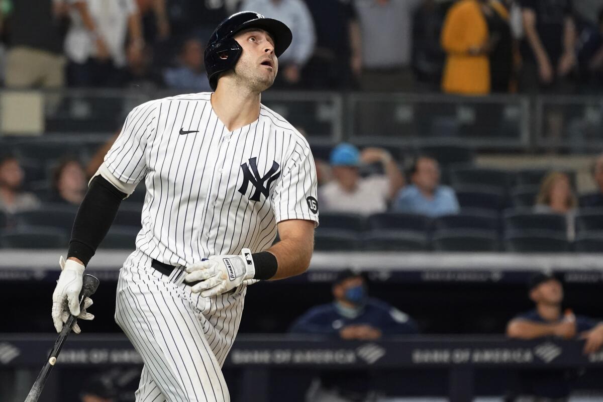 New York Yankees' Joey Gallo watches his three-run home run during the seventh inning of the team's baseball game against the Seattle Mariners, Thursday, Aug. 5, 2021, in New York. (AP Photo/Mary Altaffer)