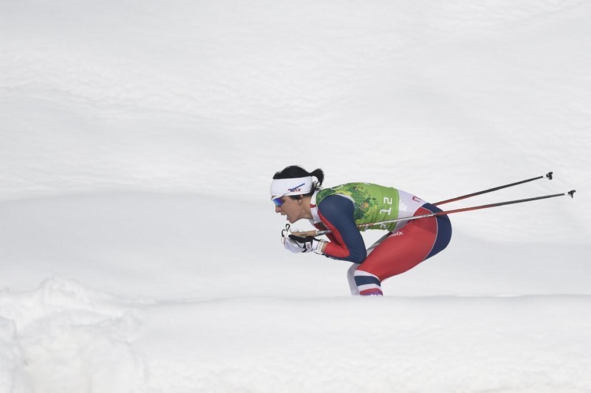 Marit Bjoergen leads Norway to the gold.