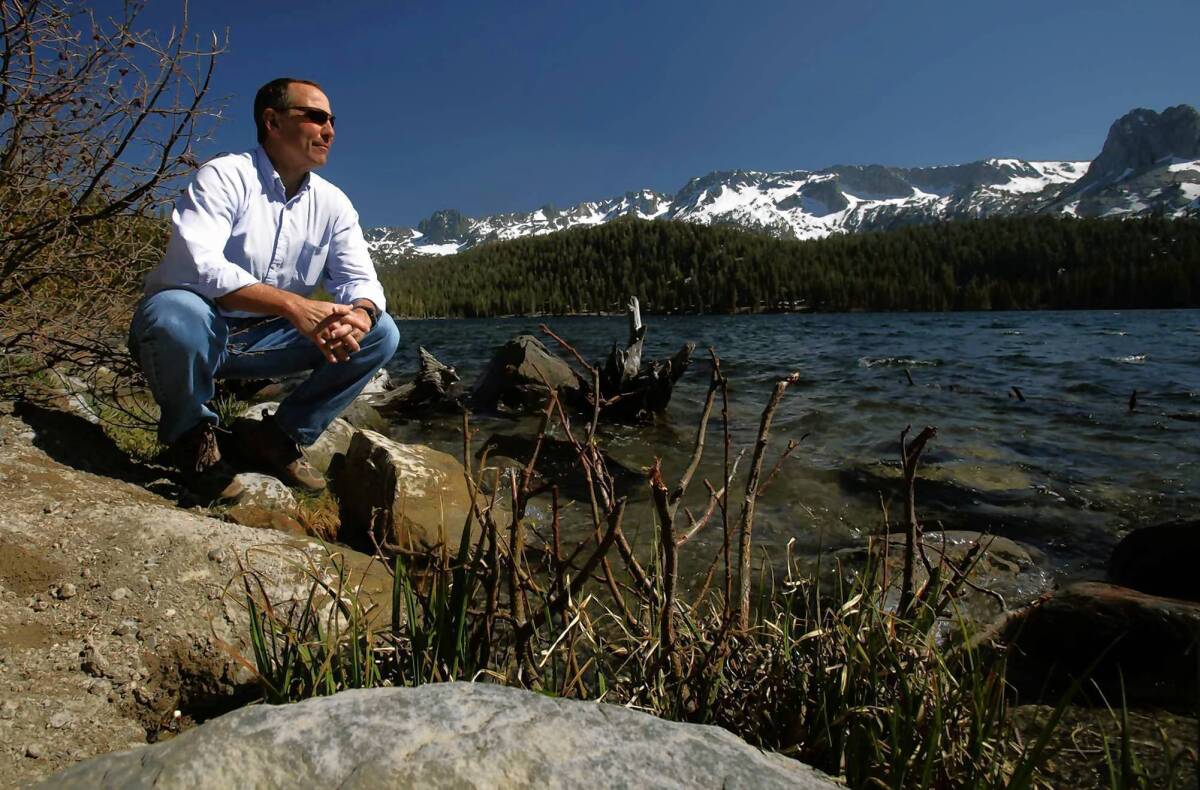 Greg Norby, general manager of the Mammoth Community Water District, visits one of his favorite spots on the shore of Lake Mary. The Mammoth Community Water District says that if it loses lawsuits filed by the Los Angeles Department of Water and Power for control of Mammoth Creek, it would have to buy water from the DWP. That would force the district to raise average rates to levels many locals cannot afford, officials say.