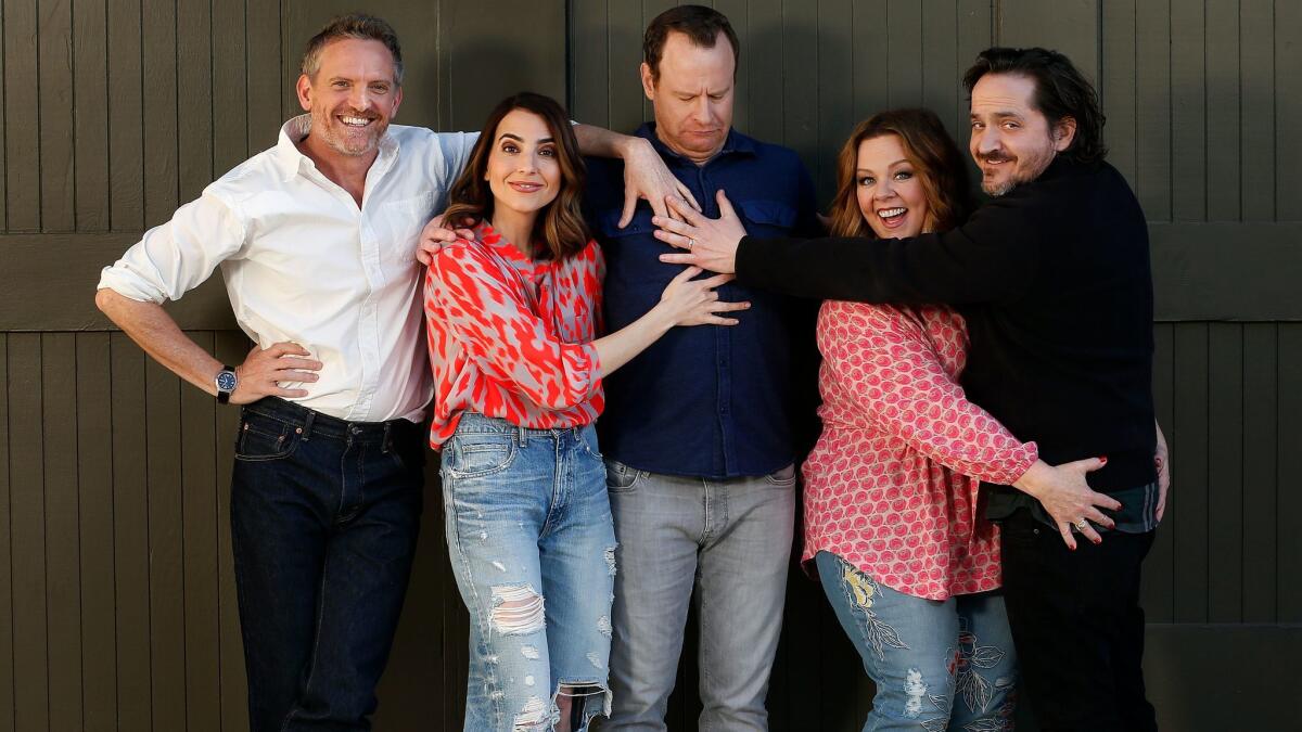 Stars of TV series "Nobodies" Hugh Davidson, left, Rachel Ramras and Larry Dorf are shown with the show's executive producers Melissa McCarthy and Ben Falcone at Warner Bros. Studios in Burbank.