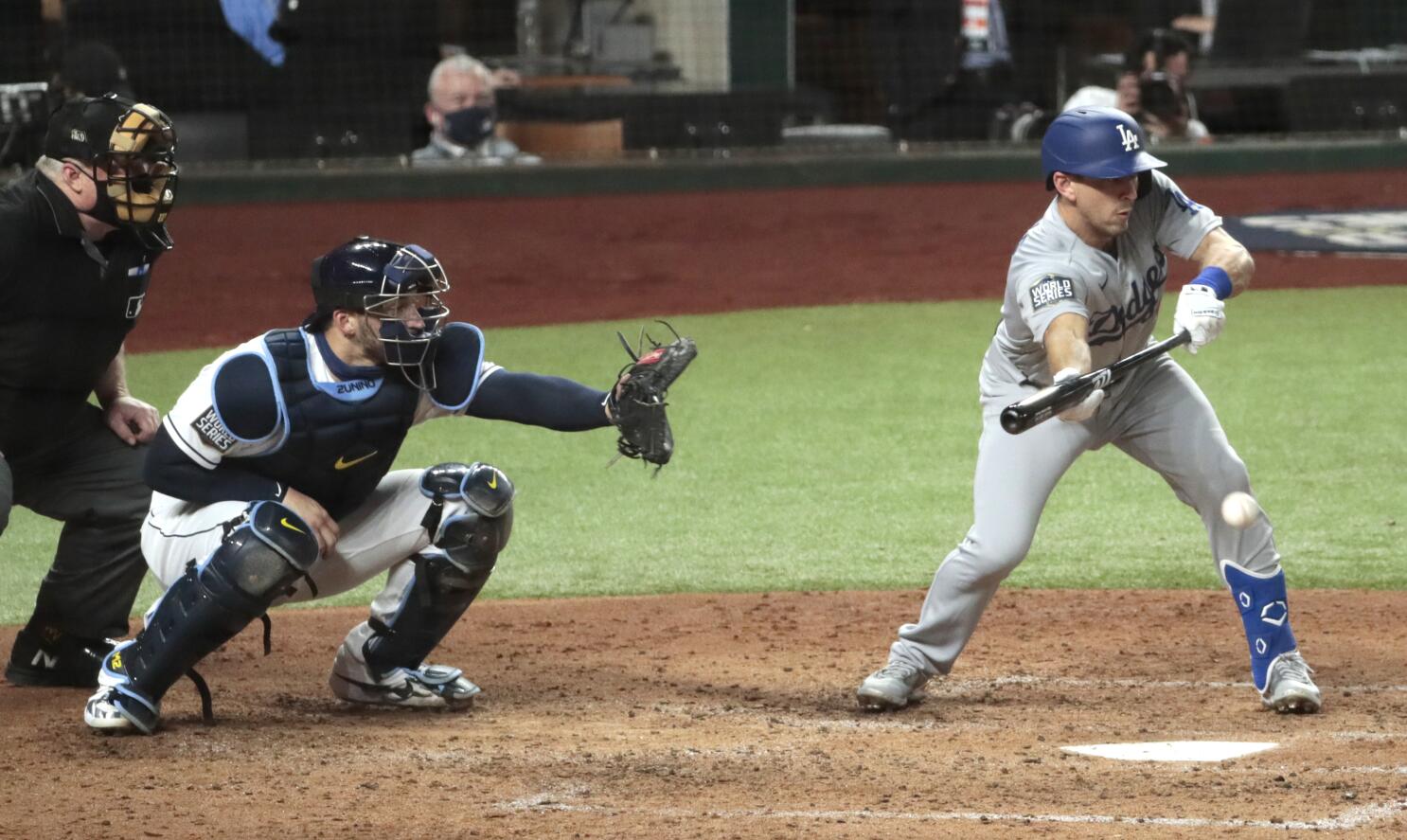 Los Angeles Dodgers' Austin Barnes lays down a RBI bunt against