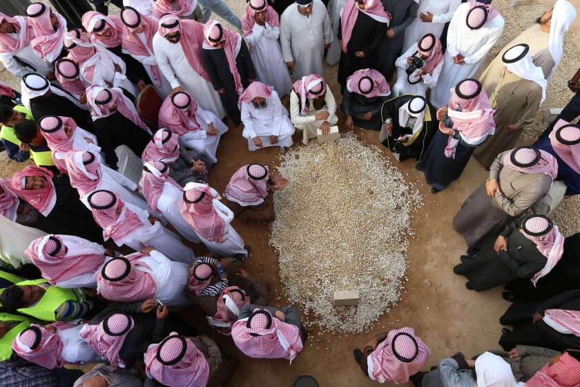 Mourners gather around the grave of Saudi Arabia's King Abdullah at Al Oud cemetery in Riyadh on Jan. 23 following his death in the early hours of the morning.