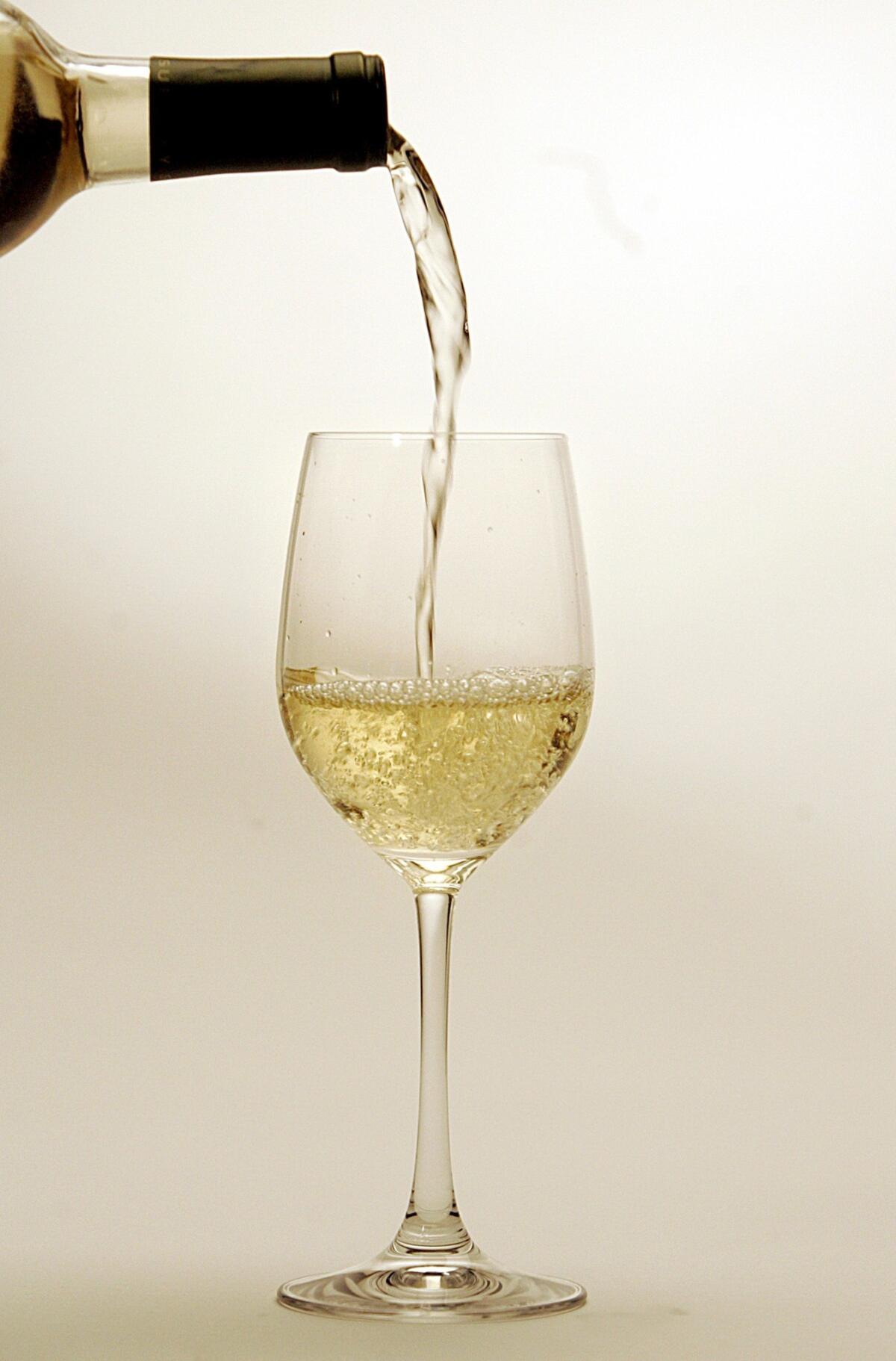 Sauvignon glass pouring.