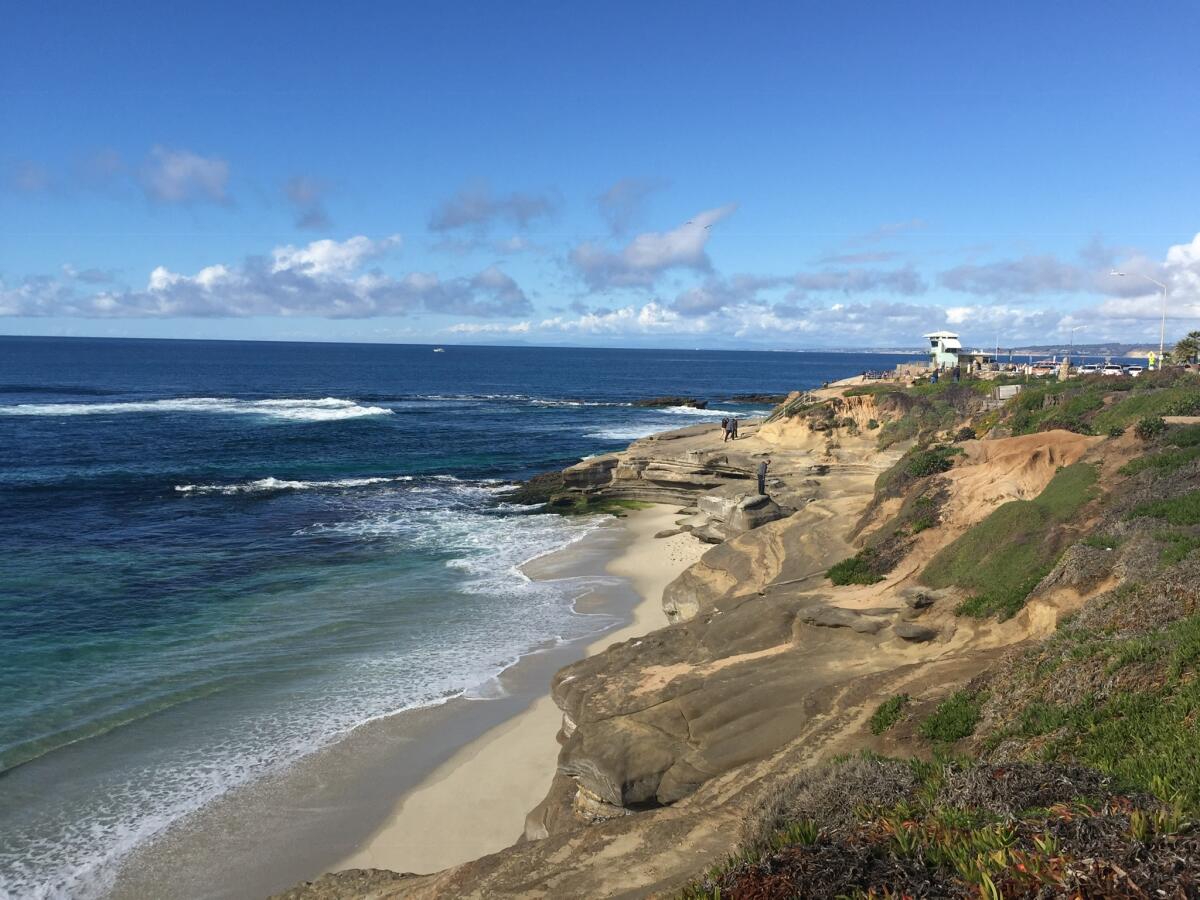 A beach with rocky cliffs