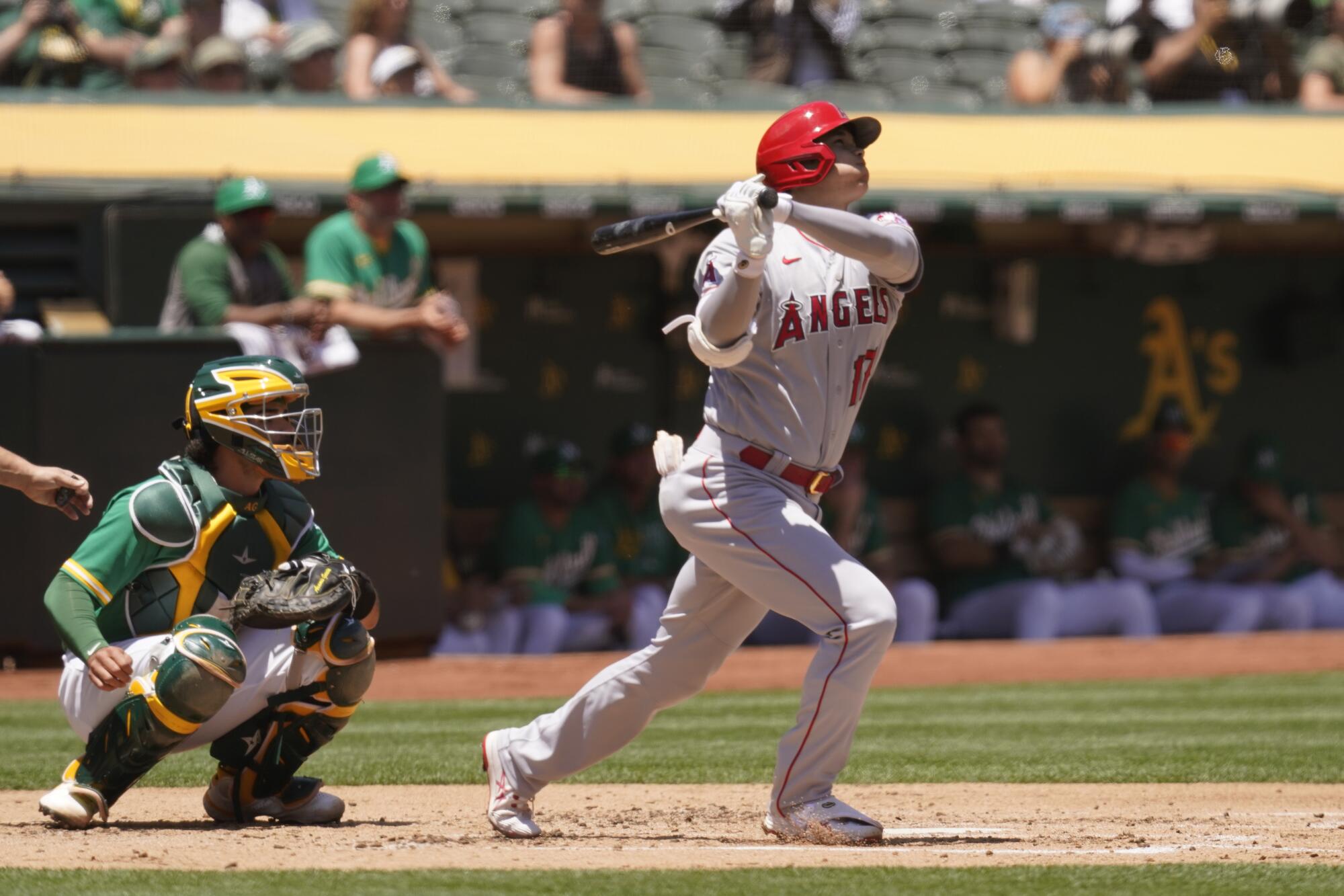 Angels designated hitter Shohei Ohtani hits a home run during the second inning against the Oakland Athletics.