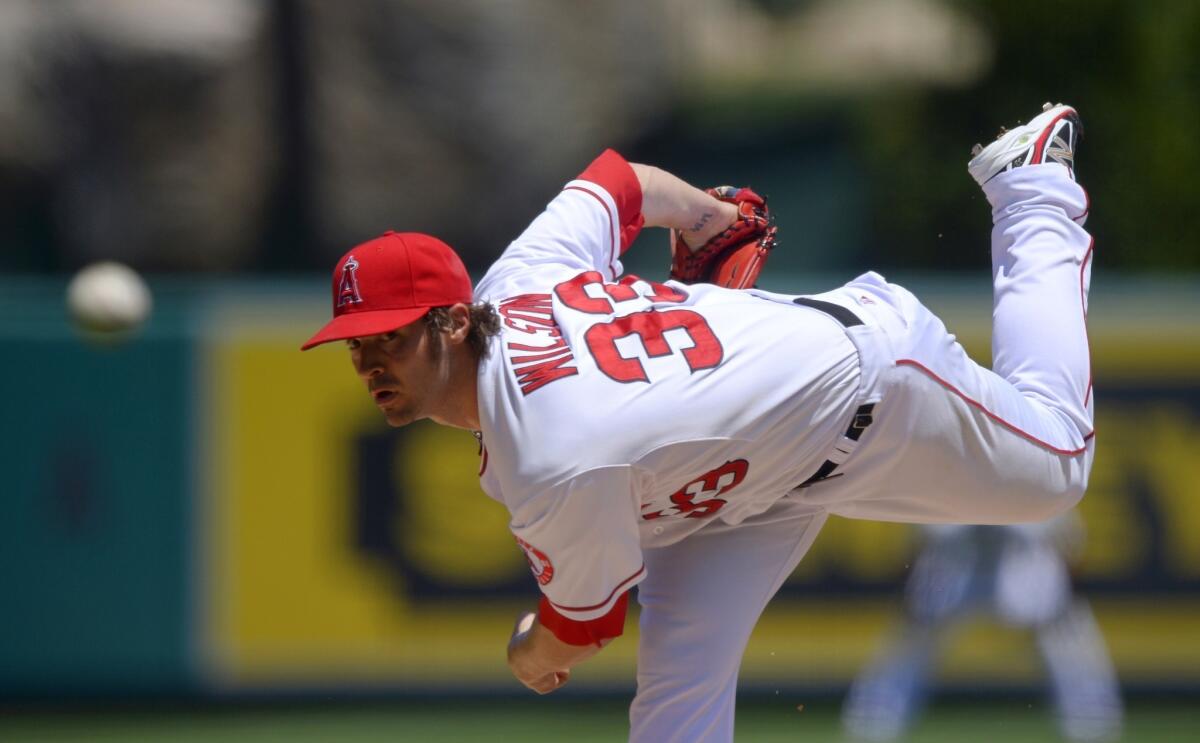 Angels starter C.J. Wilson delivers a pitch during the Angels' 6-5 loss to the Toronto Blue Jays on Sunday.