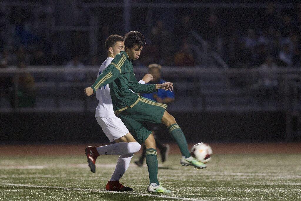 Edison High's Brian Piscopo attempts to score during the first half against Los Alamitos.