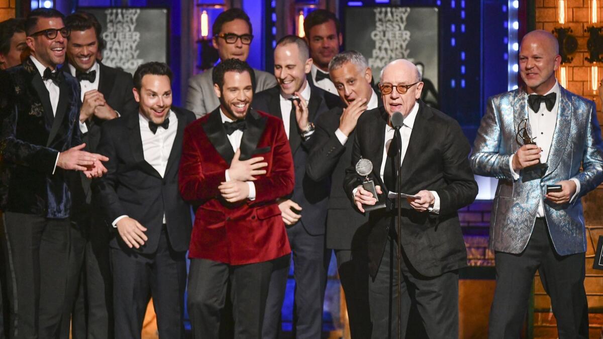 "The Boys in the Band" author Mart Crowley accepts the award for best revival of a play with a cast and crew onstage that included Zachary Quinto and Andrew Rannells, far left, and Ryan Murphy, far right.