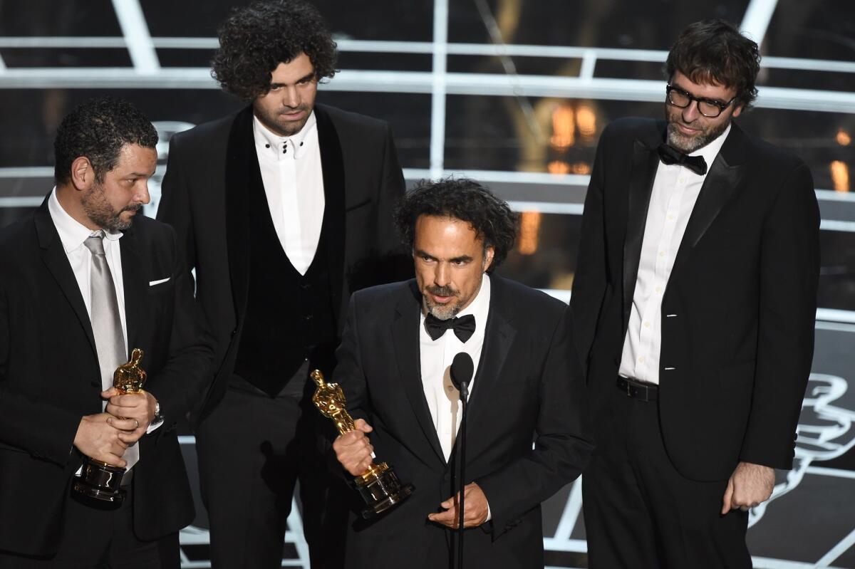 Alejandro G. Iñárritu accepts the Oscar for best original screenplay for "Birdman."