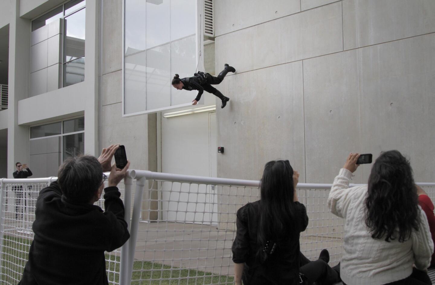 'Man Walking Down the Side of a Building'