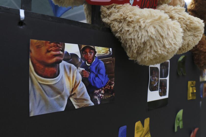 FILE - Amari Brown is seen in a photo with his father, Antonio Brown, July 6, 2015, at a memorial in Chicago. Jurors on Thursday, March 21, 2024, found 29-year-old Jamal Joiner and 28-year-old Rasheed Martin each guilty of murder in connection with the death of 7-year-old Amari Brown, the Sun-Times reported. The jurors also found them each guilty of attempted murder for wounding a woman and firing at another man whom prosecutors allege was their true target. (AP Photo/Christian K. Lee, File)