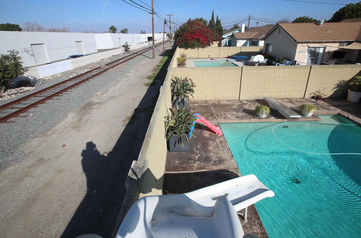 Resident Frank Clarke's backyard with pool shows the area that would be impacted.