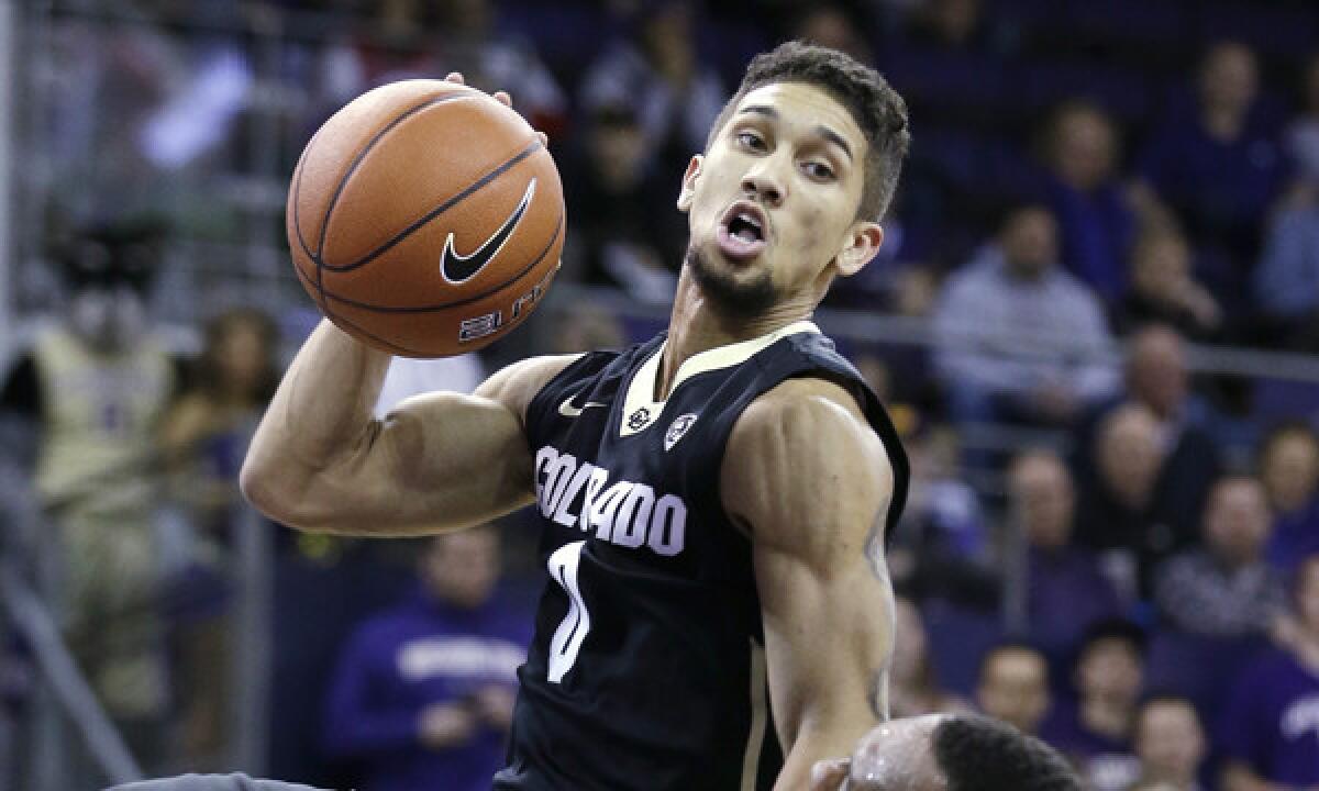 Colorado's Askia Booker drives to the basket during a game against Washington on Jan. 12. Booker has averaged 17 points per game since Buffaloes standout Spencer Dinwiddie's season-ending injury.