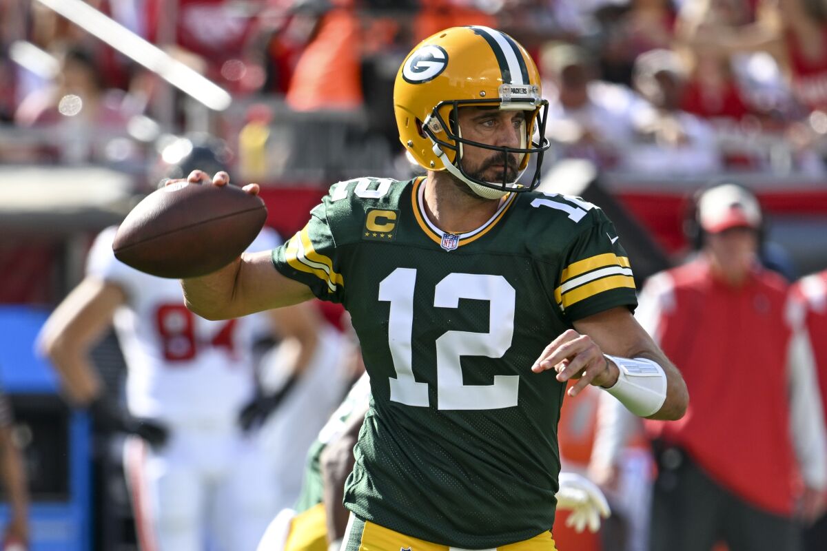 Green Bay Packers' Aaron Rodgers thorws during the first half of an NFL football game against the Tampa Bay Buccaneers Sunday, Sept. 25, 2022, in Tampa, Fla. (AP Photo/Jason Behnken)