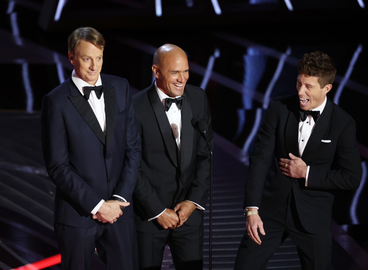 Tony Hawk, Kelly Slater and Shaun White burst into laughter onstage at the 94th Academy Awards