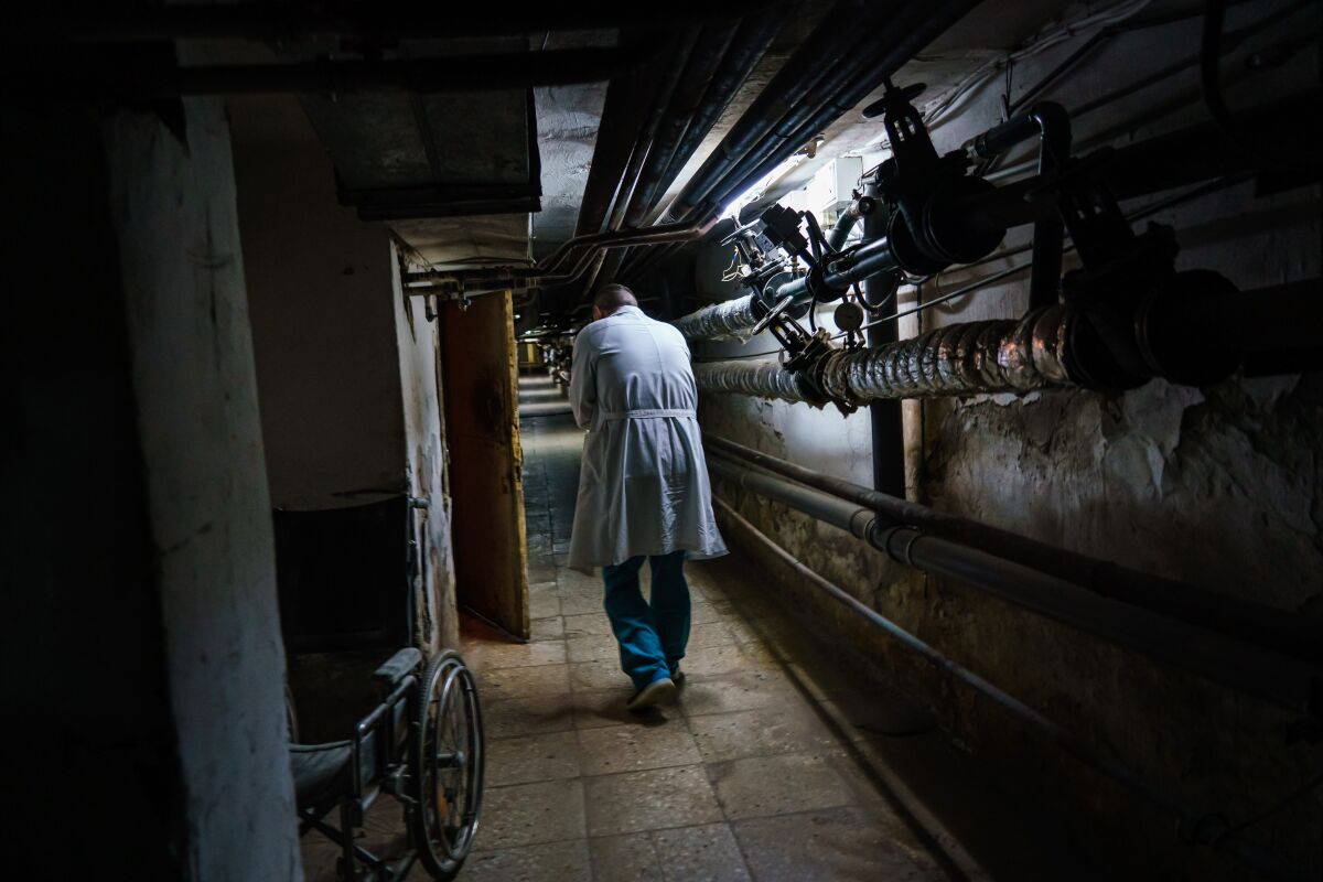 A doctor walks in a hospital basement.