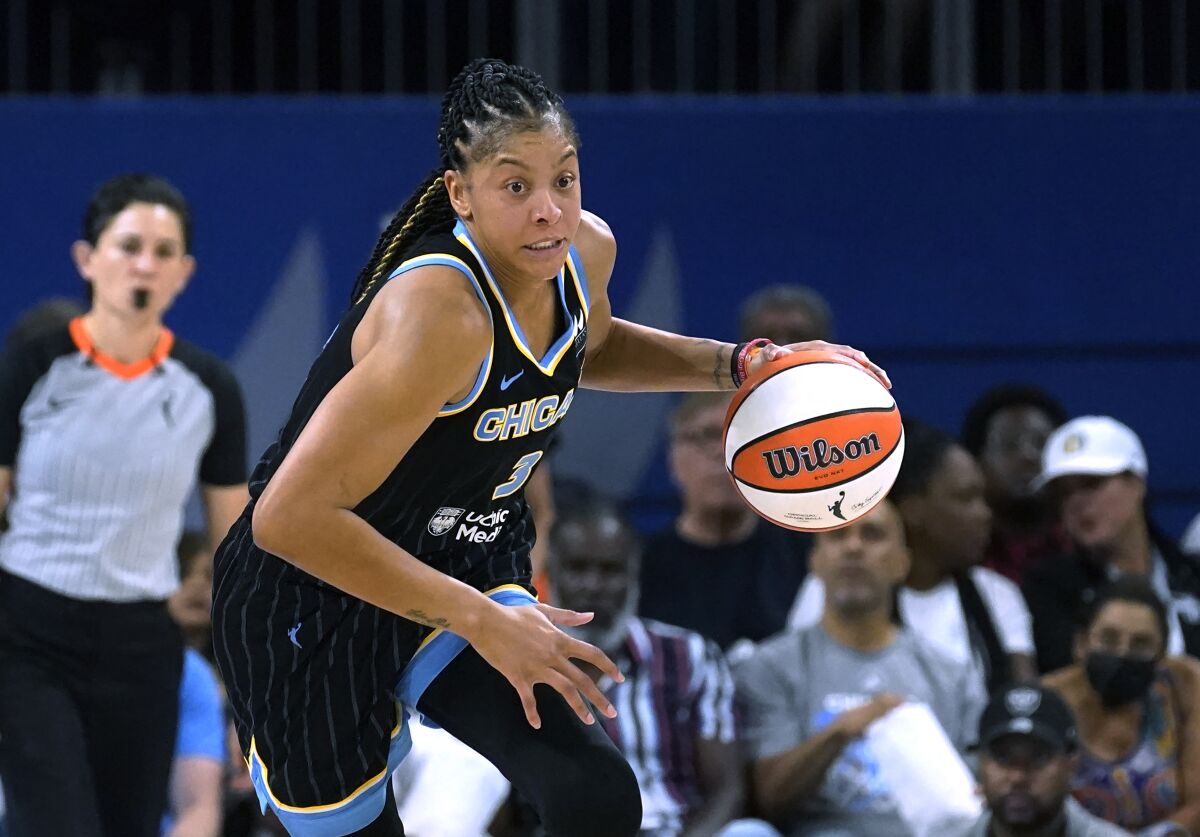 FILE - Chicago Sky's Candace Parker starts a fast break during Game 1 of the team's WNBA basketball semifinal playoff series against the Connecticut Sun on Aug. 28, 2022, in Chicago. Parker announced on social media Saturday, Jan. 28, 2023, that she would sign with the defending champion Las Vegas Aces. Parker spent the past two seasons playing for her hometown Sky, leading Chicago to the WNBA championship in 2021. (AP Photo/Charles Rex Arbogast, File)