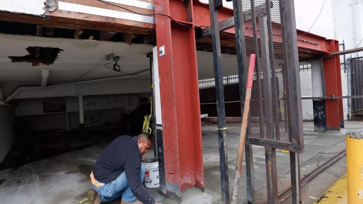 Construction worker reinforces a steel frame 