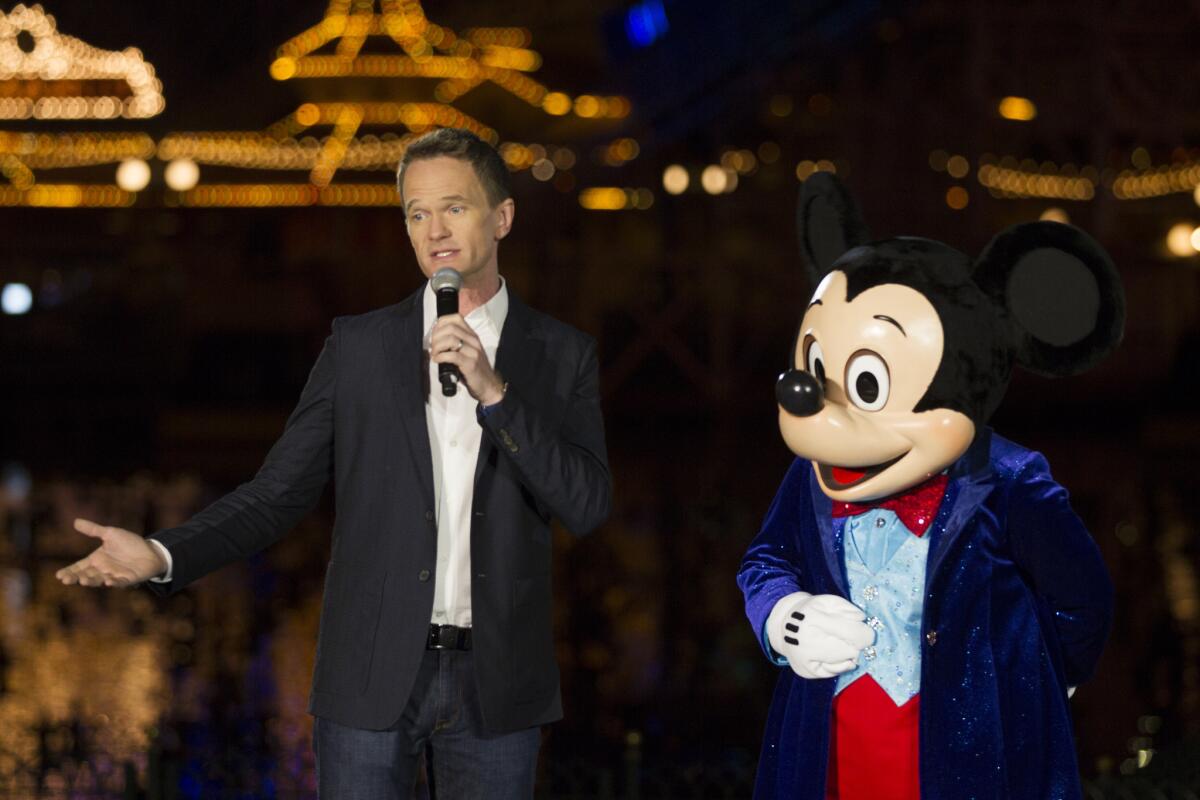 Actor Neil Patrick Harris and Mickey Mouse introduce Disney California Adventure's new "World of Color: Celebrate!" to the media for Disneyland's 60th anniversary celebration.