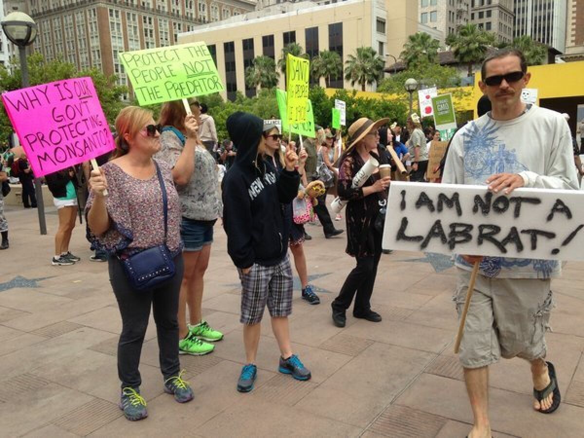 Protesters gather in Pershing Square in downtown Los Angeles on Saturday as part of a global protest against seed giant Monsanto and genetically modified food.