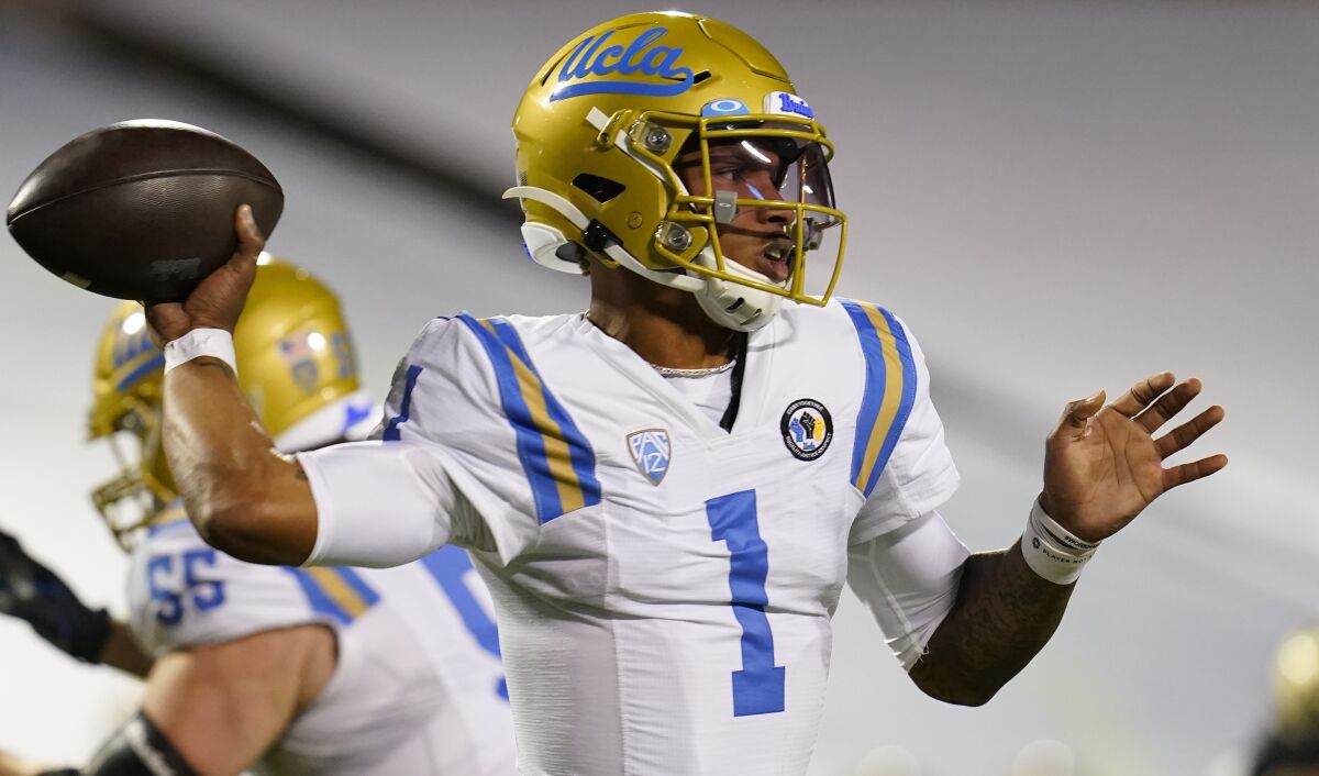 UCLA quarterback Dorian Thompson-Robinson warms up before a game against Colorado.