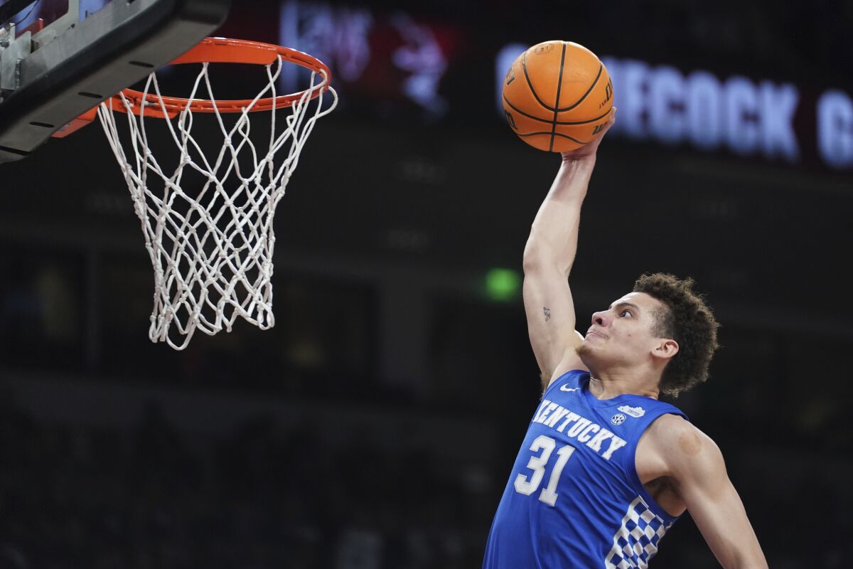 Kentucky guard Kellan Grady goes up for a dunk during the first half against South Carolina in an NCAA college basketball Tuesday, Feb. 8, 2022, in Columbia, S.C. (AP Photo/Sean Rayford)
