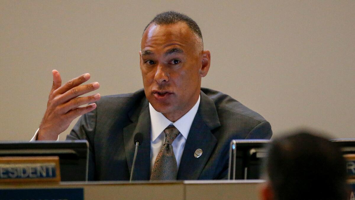Los Angeles Police Commission President Matthew Johnson confronted several activists who were interrupting other speakers at Tuesday's meeting.