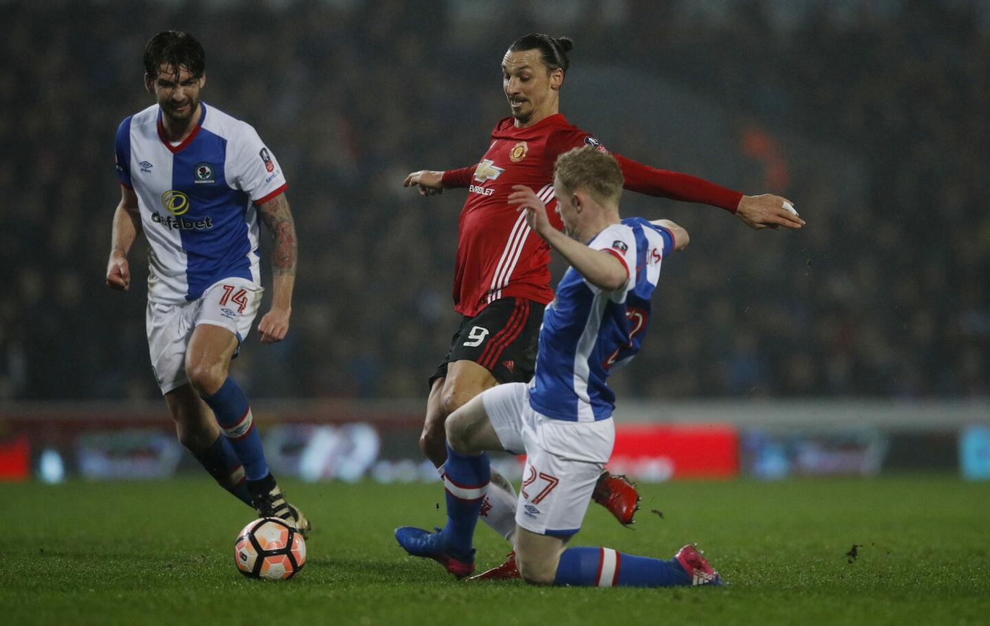 Britain Football Soccer - Blackburn Rovers v Manchester United - FA Cup Fifth Round - Ewood Park - 19/2/17 Manchester United's Zlatan Ibrahimovic in action with Blackburn Rovers' Willem Tomlinson Reuters / Phil Noble Livepic EDITORIAL USE ONLY. No use with unauthorized audio, video, data, fixture lists, club/league logos or "live" services. Online in-match use limited to 45 images, no video emulation. No use in betting, games or single club/league/player publications. Please contact your account representative for further details. ** Usable by SD ONLY **
