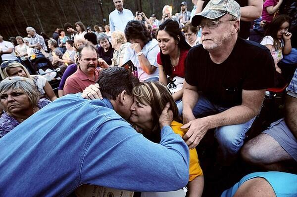 Gov. Joe Manchin, left, hugs Pam Napper, the mother of deceased coal miner Josh Napper, as she, his father Scott Napper, top right, and girlfriend Jennifer Ziegler, top left, attend a candlelight vigil Wednesday in Cabin Creek, W.Va. Napper was among the 25 miners killed on Monday during an explosion at Massey Energy's Upper Big Branch Coal Mine in Montcoal, W.Va. Napper's uncle Timmy Davis Sr. and cousin Cory Davis also died in the blast.