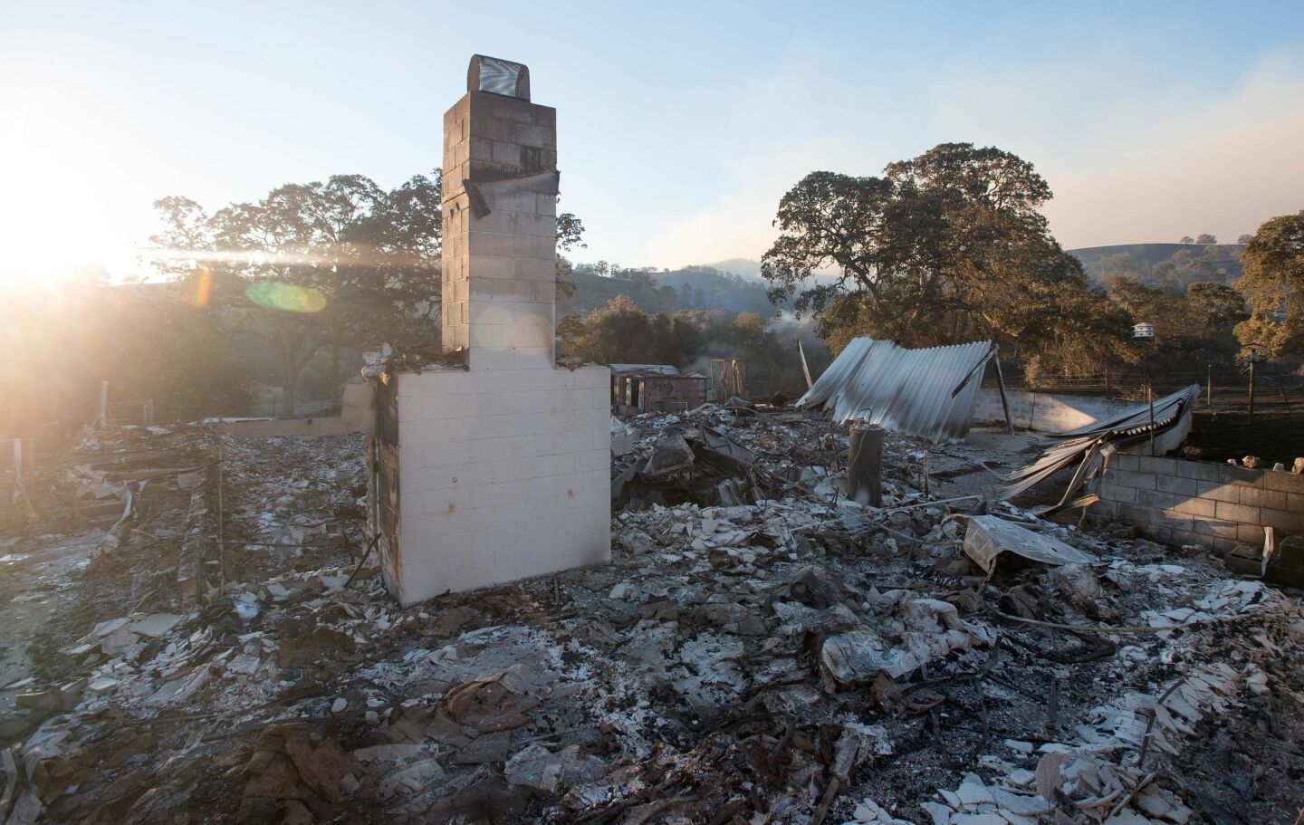 A chimney stands amid the burned-out remains of a house on July 18 near Mariposa.