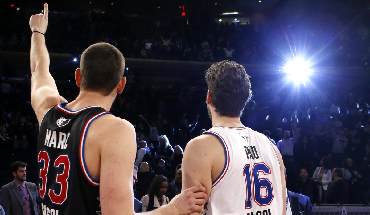 Grizzlies center Marc Gasol and Bulls forward Pau Gasol, who became the first brothers to start in an NBA All-Star game, acknowledge the fans at Madison Square Garden.