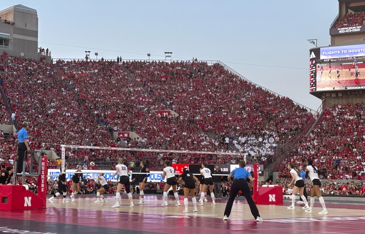 Nebraska and Omaha play a college volleyball match in front of 92,003 fans at Memorial Stadium